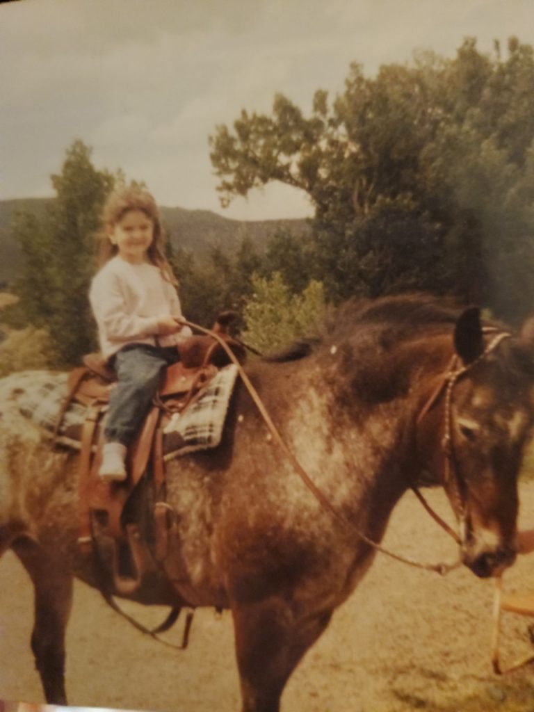 Jalaina as a child riding a horse